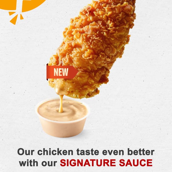 Crispy fried chicken tender with a "NEW" tag, dipping into a cup of signature sauce.