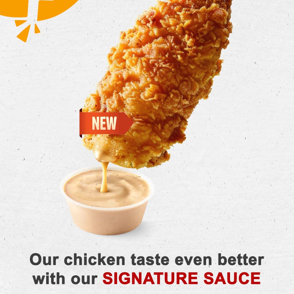 Crispy fried chicken tender with a "NEW" tag, dipping into a cup of signature sauce.